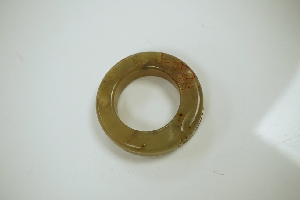 Two Chinese soapstone bi discs, and a jade ring, 18th century or earlier, largest 6.5cm in diameter. Condition - good